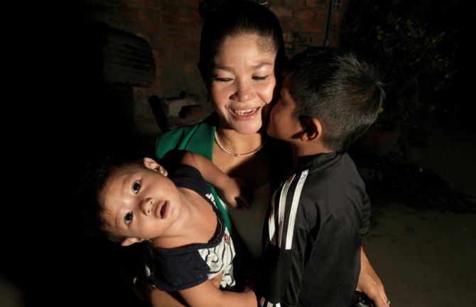 Before going to work, she gets a kiss from her boys. Her mother will take care of them, while she works the night shift. Before going to work, she gets a kiss from her boys. Her mother will take care of them, while she works the night shift.