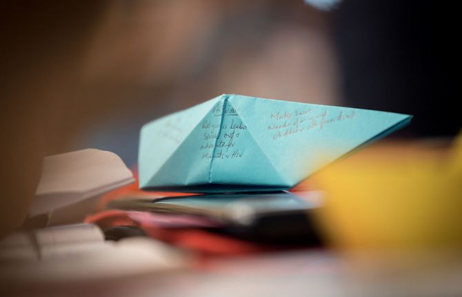 Photo: Albin Hillert/WCC. 20 February 2019, Geneva, Switzerland: Remembering the many people on the move, and the particular vulnerability of people migrating by boat, participants write down challenges and ways forward on symbolic boats during the worksh Photo: Albin Hillert/WCC. 20 February 2019, Geneva, Switzerland: Remembering the many people on the move, and the particular vulnerability of people migrating by boat, participants write down challenges and ways forward on symbolic boats during the worksh
