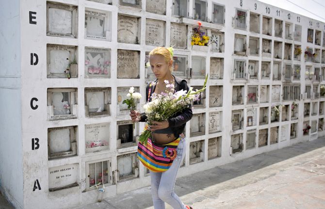 Nearly every week, Yasuri visits the Baquijano Cemetery to leave flowers and pray at a Peruvian saint’s tomb. She said she can no longer stand sex work. “It makes me sick,” said Yasuri, who dreams of having a family and getting married one day. Nearly every week, Yasuri visits the Baquijano Cemetery to leave flowers and pray at a Peruvian saint’s tomb. She said she can no longer stand sex work. “It makes me sick,” said Yasuri, who dreams of having a family and getting married one day.