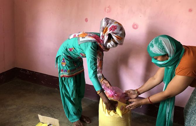 ICWAP staff distributing emergency supplies, including food and sanitary products, to women and girls living with HIV in western Nepal at the beginning of the pandemic in 2020 ICWAP staff distributing emergency supplies, including food and sanitary products, to women and girls living with HIV in western Nepal at the beginning of the pandemic in 2020