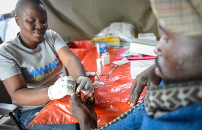 Mmote Mohasi, a voluntary medical male circumcision client, is tested for HIV at a mobile clinic in a remote area outside Braakfontein, Lesotho, before he undergoes voluntary medical male circumcision. 31 October 2019. Mmote Mohasi, a voluntary medical male circumcision client, is tested for HIV at a mobile clinic in a remote area outside Braakfontein, Lesotho, before he undergoes voluntary medical male circumcision. 31 October 2019.