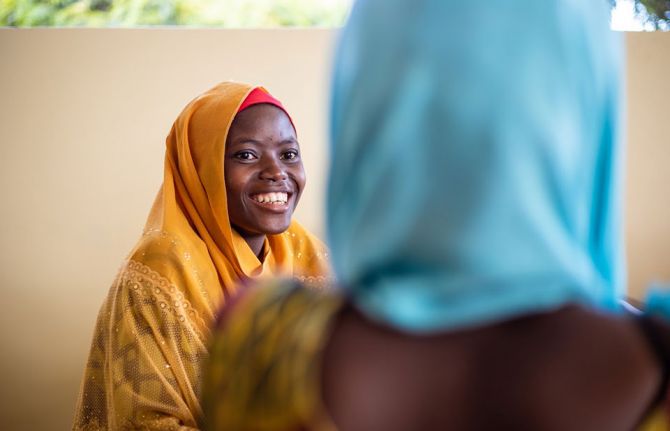 Wansama Johnson, a young woman living with HIV, sensitizing a client, right, at a care and treatment clinic. Kigamboni, Dar es Salaam, Tanzania, 1 October, 2019. Credit: UNAIDS/D.Msirikale Wansama Johnson, a young woman living with HIV, sensitizing a client, right, at a care and treatment clinic. Kigamboni, Dar es Salaam, Tanzania, 1 October, 2019. Credit: UNAIDS/D.Msirikale