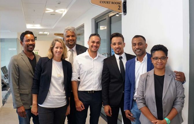 Abdool Ridwan Firaas (Ryan) Ah Seek, third from right, the plaintiff; with members of Collectif Arc-En-Ciel at the Supreme Court in November 2021. COurtesy of Human Dignity Trust Abdool Ridwan Firaas (Ryan) Ah Seek, third from right, the plaintiff; with members of Collectif Arc-En-Ciel at the Supreme Court in November 2021. COurtesy of Human Dignity Trust