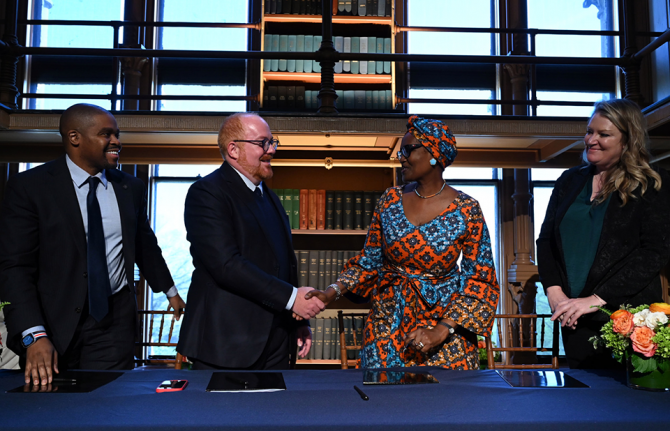The agreement formalizing UNAIDS Collaborating Center was signed April 12 at Georgetown by (l to r) Christopher King, dean of the School of Health; Matthew Kavanaugh, director of the Global Health Policy and Politics Initiative and assistant professor in The agreement formalizing UNAIDS Collaborating Center was signed April 12 at Georgetown by (l to r) Christopher King, dean of the School of Health; Matthew Kavanaugh, director of the Global Health Policy and Politics Initiative and assistant professor in